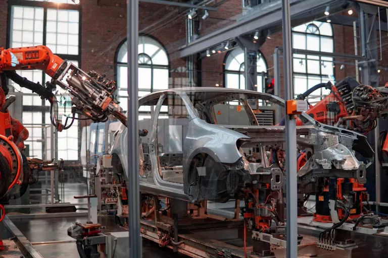 Automated robots assembling a car