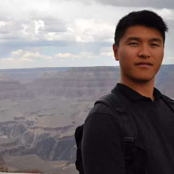 William Kan, Drupal Developer, profile photo taken at the Grand Canyon on a cloudy day